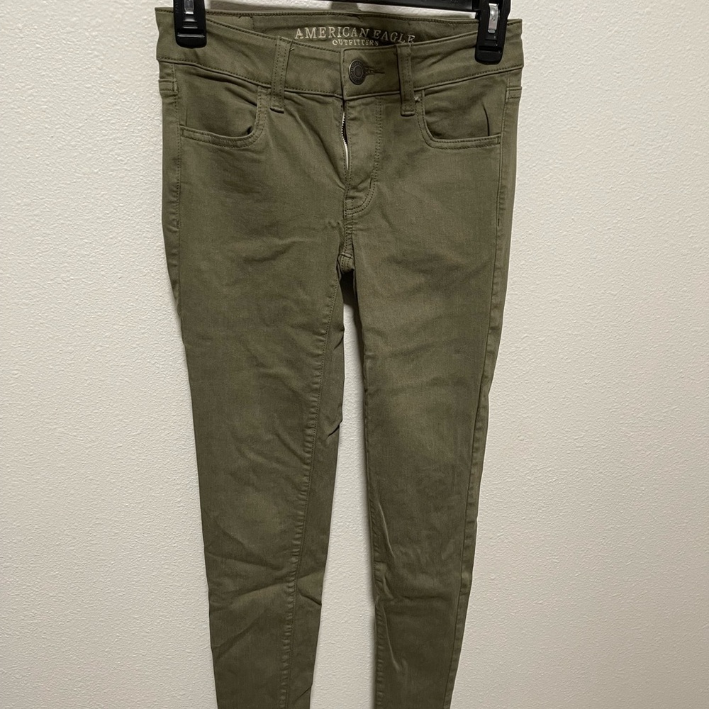 American Eagle green skinny jeans